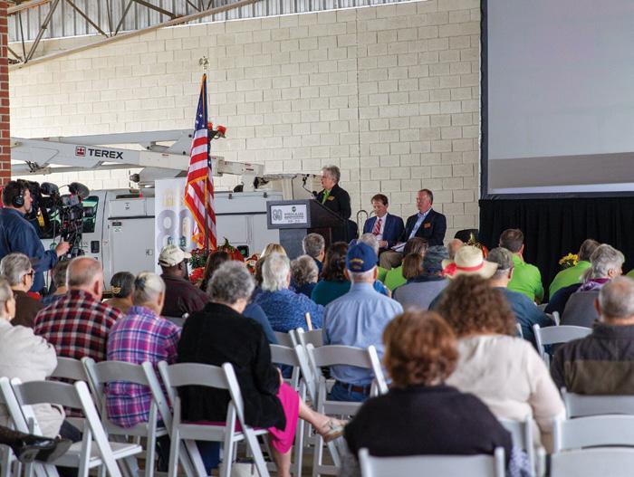 large group of people sitting in chairs at meeting