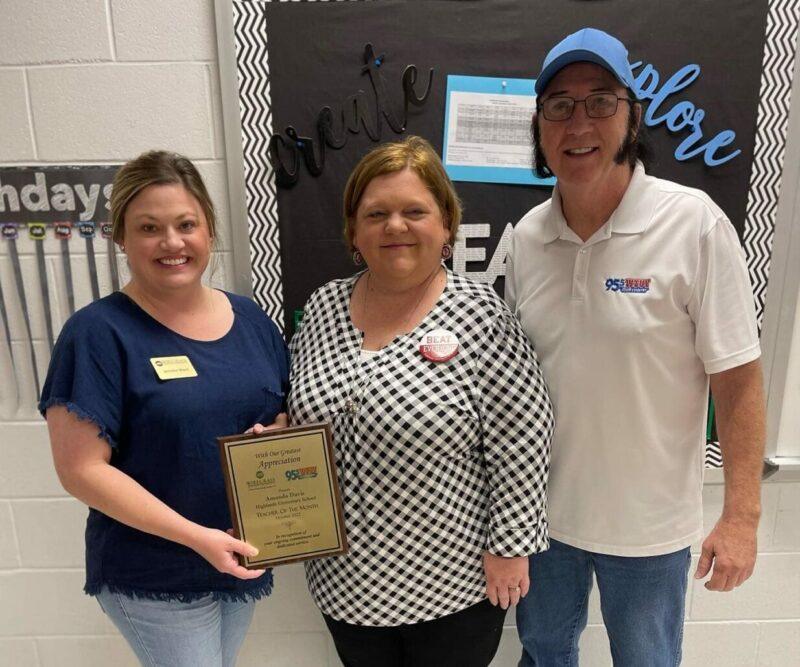 Teacher receiving Teacher of the month award