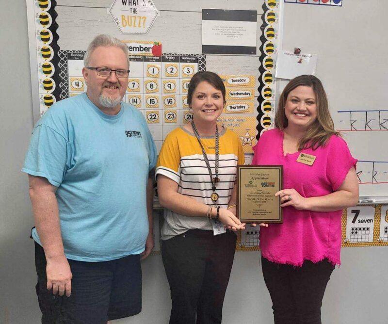 Teacher receiving Teacher of the month award