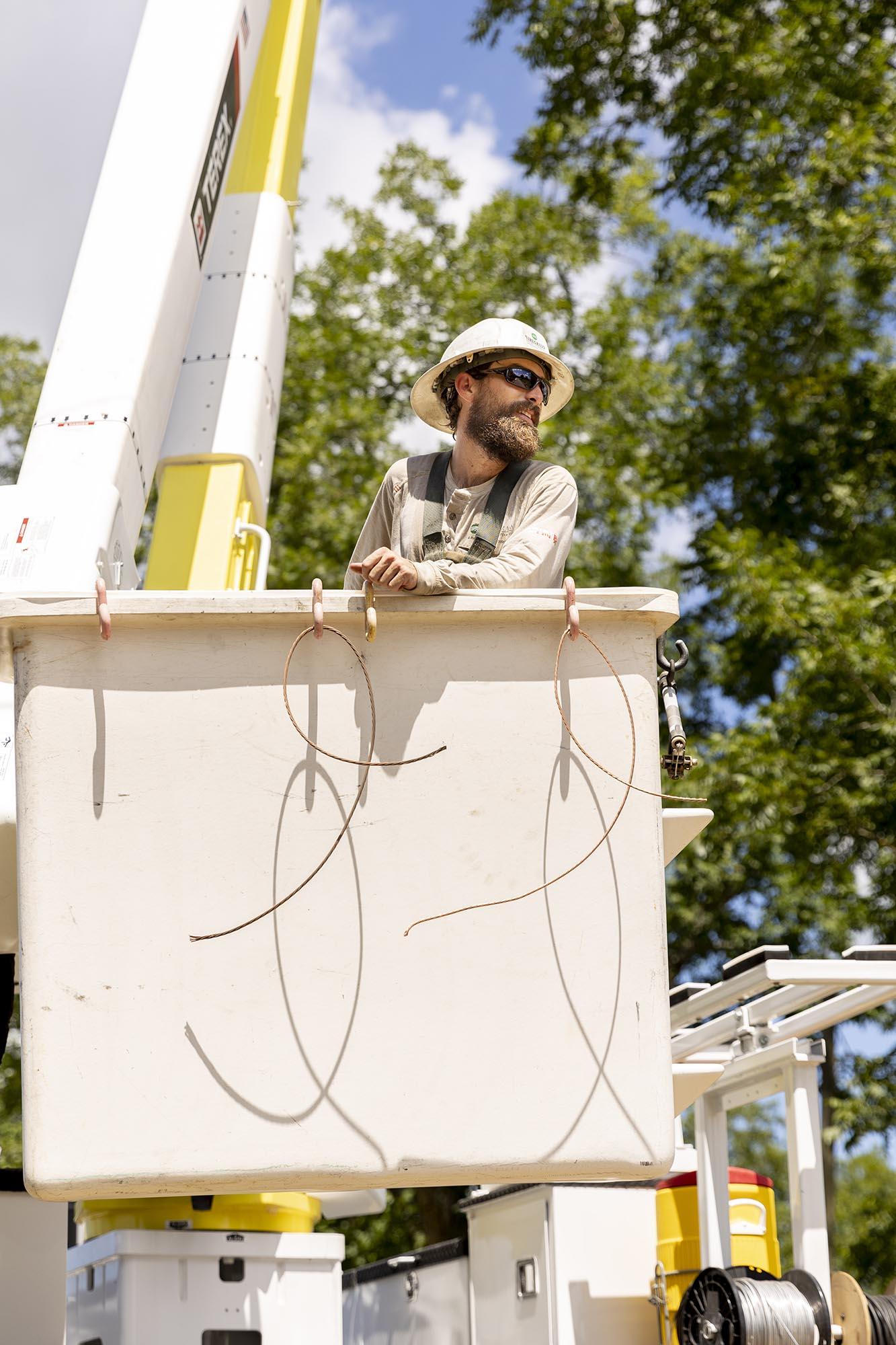 WEC Employee in a bucket truck