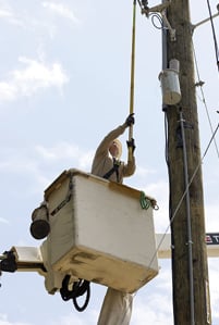 Lineworker uses hot stick