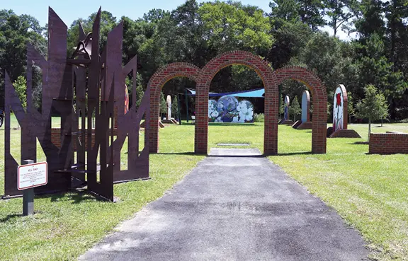 Brick arches mark the entrance to Chapel in the Oaks.